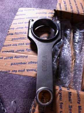 Forged connecting rod for a 4.6L Mustang engine upgrade replacing the weak factory powdered-metal rods