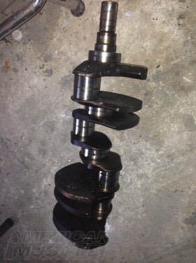 4.6L Mustang crankshaft showing the factory cast-iron unit used in 1999-2004 GT engines