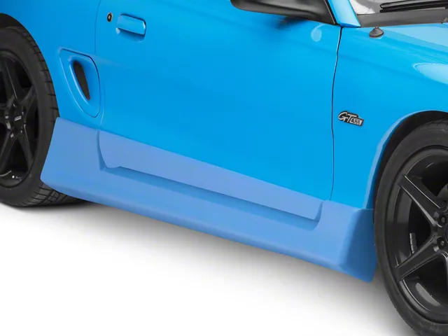 SN95 Mustang side skirt kit installed beneath the doors, featuring extended rocker panel styling designed to enhance the vehicle's appearance and aerodynamic profile.