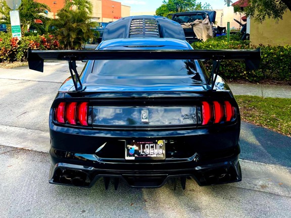 Cat-back exhaust with black tips on a Mustang GT Fastback