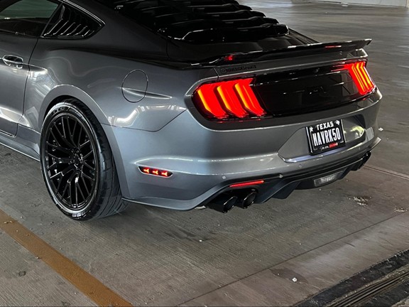 Cat-back exhaust with black chrome tips on a Mustang GT with active exhaust