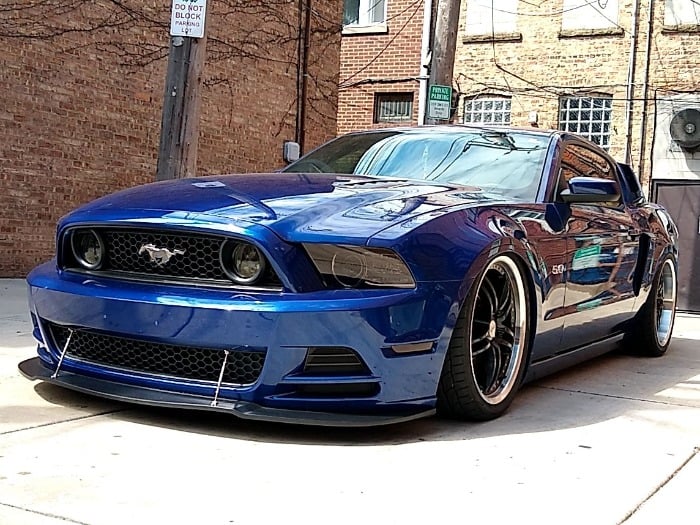 Mustang with camber-adjusted suspension highlighting performance and practicality
