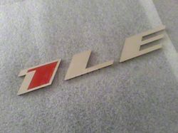 1LE Emblem; Stainless Steel with Red Insert (10-23 Camaro)