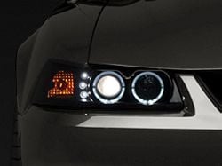Raxiom Dual LED Halo Projector Headlights; Black Housing; Smoked Lens (99-04 Mustang)